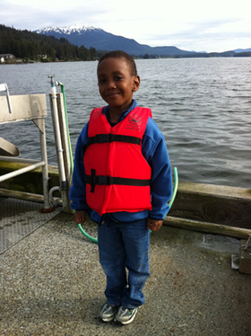 EZ in a Kids Don't Float pdf on an Alaskan Dock