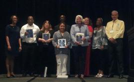 Awards presented at the Symposium  (L-R Elisa Cramer, Award recipients: Darryl Watson, Jean Costa, Bobbie Badonski Ceglecki, Ola Lasisi , Kelly Kelley