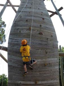 Foster youth on climbing wall during Palm Beach County Camps for Champions