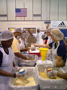 Some of the volunteers packaging food