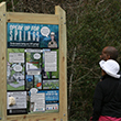 Two visitors study one of the new kiosks.