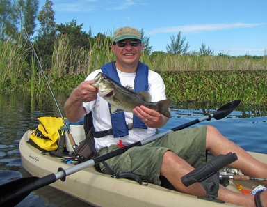 Kayak angler with bass
