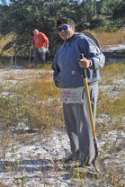 Ridge Ranger uses a shovel to plant acorns