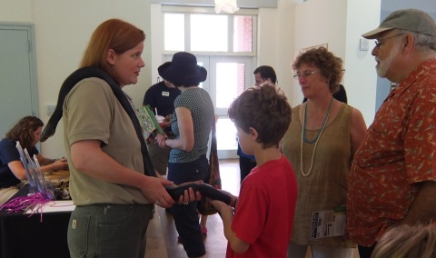 DNR's Linda May with indigo snake at Endangered Species Day