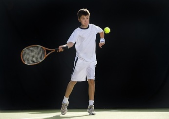 Boy playing tennis