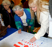 Signing Veteran's Poster at Seniors Resource Day