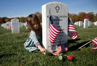 baby at veteran grave