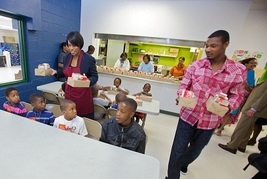 Mayor Rawlings-Blake and Adam Jones help feed Baltimore kids