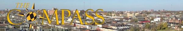 Compass Banner with City Skyline Image in Background