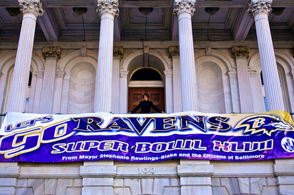 IMAGE: Mayor Rawlings-Blake displays a "Go Ravens!" banner at City Hall