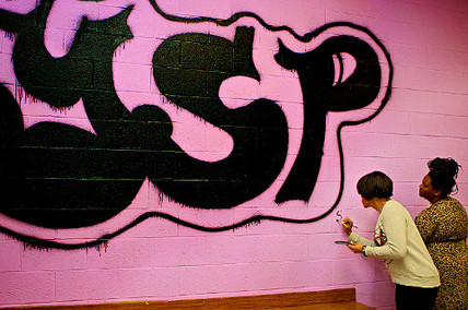 IMAGE: Mayor Rawlings-Blake adds her signature to a mural at Furley Rec Center