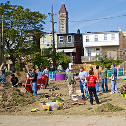 IMAGE: Neighbors beautify a vacant lot with the Power in Dirt initiative