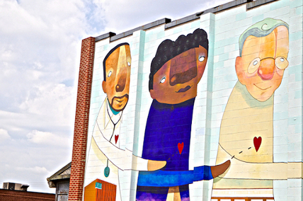 IMAGE: A charming mural on the side of a Park Heights building