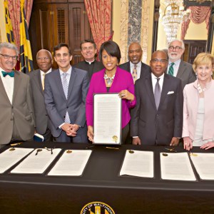 IMAGE: Mayor Rawlings-Blake and anchor institution leaders sign a pledge of collaboration for the Baltimore City Anchor Plan
