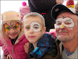 Photo of: Kids and grandpa with faces painted