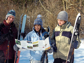 Photo of skiiers looking at map