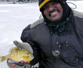 Photo of man holding fish