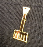 golden shovel lapel pin