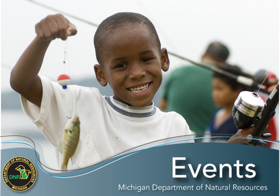 Young boy holding a fish
