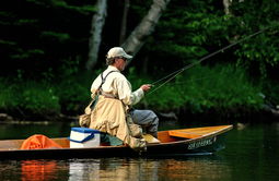Man trout fishing from a boat