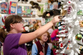 A young girl browses the holiday offerings at the Michigan Historical Museum Store in downtown Lansing.