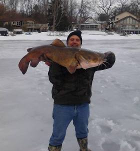 Dale Blakley of Niles, Mich., caught a state-record, 52-pound flathead catfish out of Barron Lake in Cass County on Jan. 12.