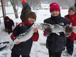 Kids fishing on Crystal Lake in the winter