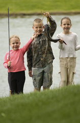 Kids holding up the fish they caught