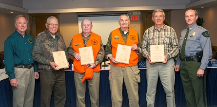 Four hunter ed instructors receiving awards for volunteer service