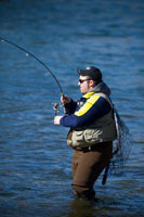 Angler fishing for steelhead in Michigan