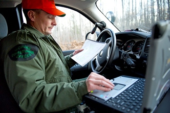 Conservation officer in vehicle