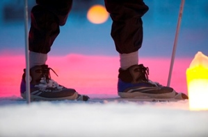 skis backlit by candlelight