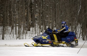 snowmobiler on Michigan trail