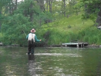Angler fly fishing on an inland water body