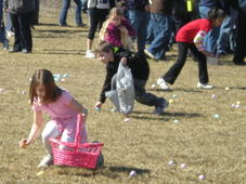 Kids run to collect their prizes at a Michigan state park egg hunt event