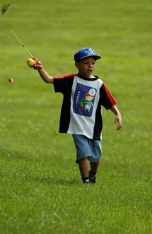 little boy holding a fishing pole