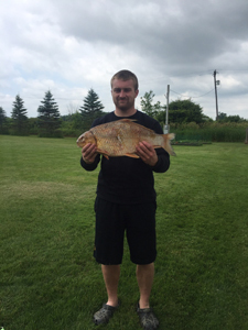 Garrett Reid holds state record quillback he caught