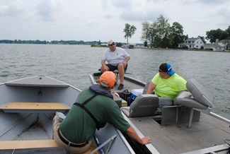 DNR creel clerk Shawn Spilak talks to anglers