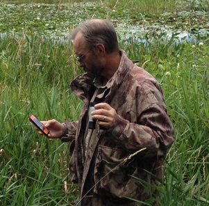 waterfowl hunter with smart phone