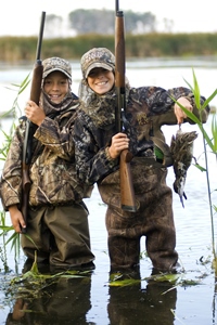 two young male waterfowl hunters