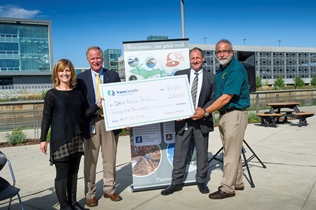 DNR, TransCanada officials at check presentation, Lansing City Market