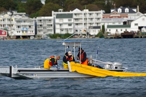 mock oil spill response crew on water