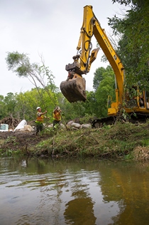 DNR crew works on a river bank