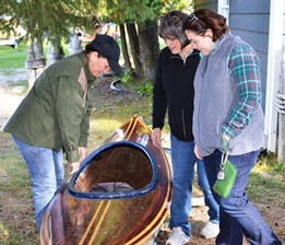 NRC member Louise Klarr looking at a kayak