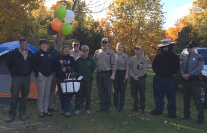 DNR staff members and Smokey Bear congratulate Linda Wells for being one millionth camper