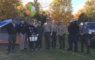 DNR staffers with 1 millionth camper at Proud Lake campground