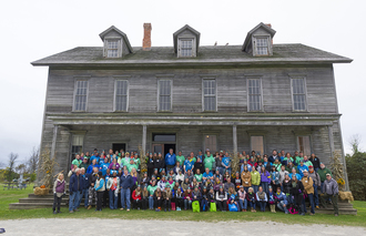 100-plus volunteers in front of Fayette Historic State Park hotel