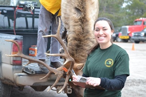 DNR staff member checking in elk hunter