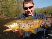 Male youth with a brown trout