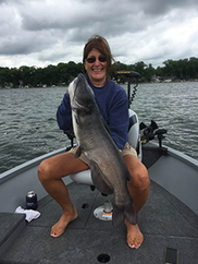 Female holding a channel catfish